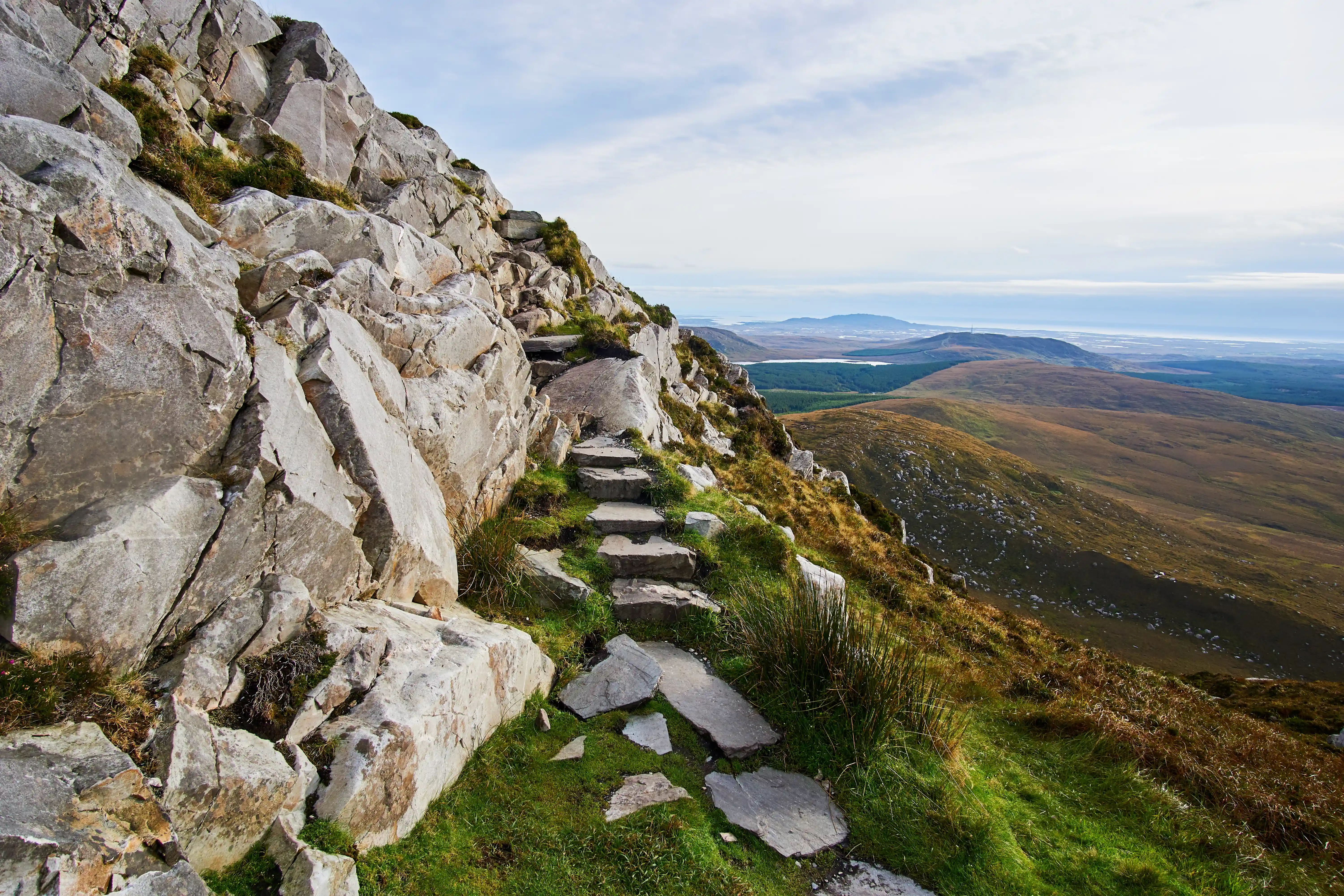 Rocky mountain trail overlooking the Irish landscape